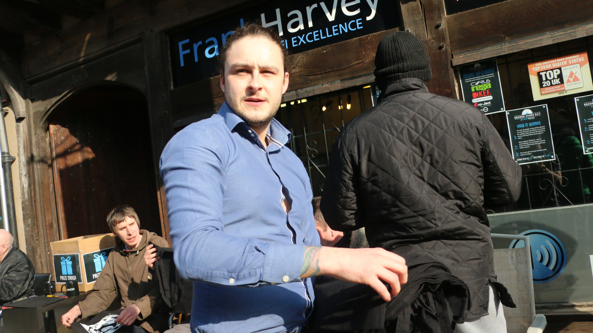 Man standing outside the frank harvey hifi excellence shop on record store day