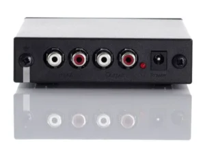 The back panel of a Rega fono mini A2D phono preamplifier, showing the RCA input and output ports, as well as the power port.