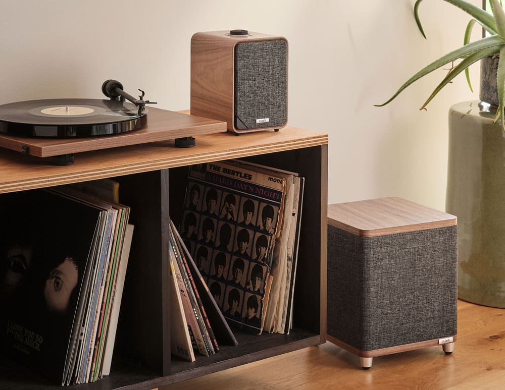 Ruark RS1 subwoofer in walnut with turntable and speakers
