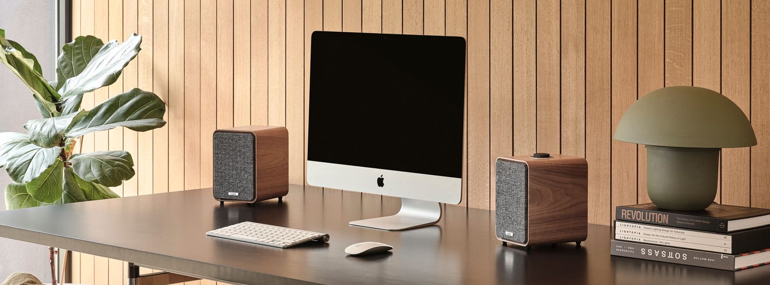 Ruark MR1 desktop speakers on desk with Apple iMAC computer