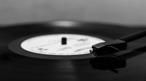 A close up photo of a vinyl record being played in a record player